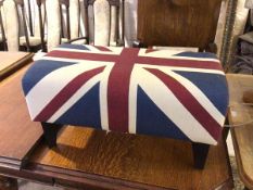 A contemporary footstool with Union Jack upholstery on ebonised square tapering supports (36cm x