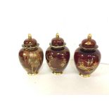 A set of three 1930s/40s Carltonware lidded baluster shaped vases, one stamped Carltonware