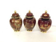 A set of three 1930s/40s Carltonware lidded baluster shaped vases, one stamped Carltonware