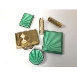 A 1920s/30s Birmingham silver cigarette case with mint green guilloche exterior and a matching