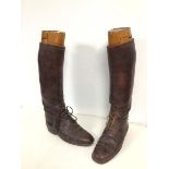 A pair of vintage brown leather boots with wooden boot trees: (single boot : 45.5cm x 28cm x 9cm )