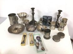 An assortment of Epns and metalware including dishes, pepperettes, trophy, a pair of pewter