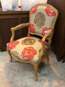 A contemporary Louis XV style fauteuil, with beech frame and stylised rose head pattern