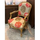 A contemporary Louis XV style fauteuil, with beech frame and stylised rose head pattern