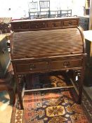 A Chinese roll top desk with four drawer superstructure above tambour roll top, with fitted interior