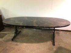 A modern dining table with marble effect resin tablet shaped top on C scroll metal base (78cm x