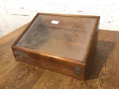 An Edwardian display table top cabinet, with sloped glazed top, with an additional hinged door to