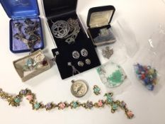 An assortment of costume and silver jewellery including a niello silver bracelet, a pewter