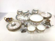 A mixed lot of china including eight teacups, nine saucers, side plate and bowl (9cm x 15cm), all in