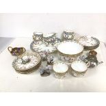 A mixed lot of china including eight teacups, nine saucers, side plate and bowl (9cm x 15cm), all in