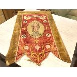 A late 19thc religious banner, St Agnes, the velvet border with gilt metal edge enclosing a red