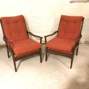 A pair of stained beech Cyntique style open arm easy chairs with upholstered squab back and seat