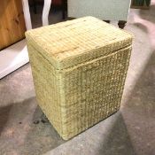 A wicker rectangular laundry basket with hinged top (60cm x 52cm x 43cm)