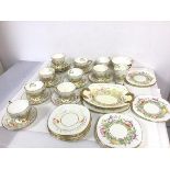 A 1930s Royal Stafford teaset, including nine teacups, saucers, side plates, serving plates, milk