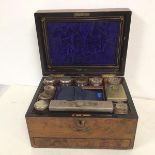 A Regency gentleman's toiletry box complete with an assortment of bottles and boxes with Epns