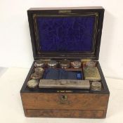 A Regency gentleman's toiletry box complete with an assortment of bottles and boxes with Epns