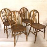 A set of four ash Windsor style pierced splat back and spindle back kitchen dining chairs with