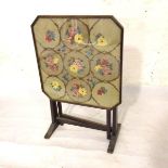 A 1930s oak octagonal glazed tapestry firescreen with fold down top and gateleg (77cm upright. d.