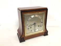 A 1930s/40s mahogany mantel clock, the metal dial marked Elliott Clock (23cm x 24cm x 13cm)