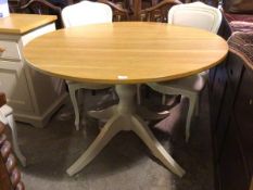 A Laura Ashley circular dining table with oak top on painted pedestal base (78cm x 120cm)