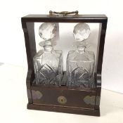 A 1930s/40s tantallus, complete with two glass decanters (32cm x 25cm x 14cm)
