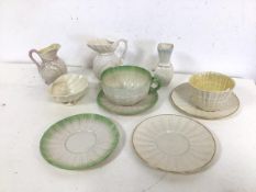 A collection of early to mid 20thc Beleek including two teacups, four saucers, two milk jugs, dish