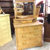 An Edwardian oak Arts & Crafts dressing chest, the rectangular swing mirror with bevelled glass