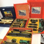 Four boxed sets of toy trains, two by Hornby and two by Mettoy, all in original boxes (a/f), with