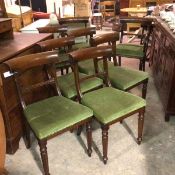 A set of six plus two reproduction Regency style mahogany dining chairs with curved top rails and