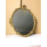 A modern wall mirror with gilt metal Classically inspired frame, with ribbon surmount (56cm x 47cm)