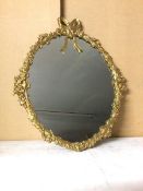 A modern wall mirror with gilt metal Classically inspired frame, with ribbon surmount (56cm x 47cm)