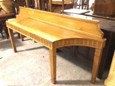 A specially commissioned satinwood birch hall ledge back console table, the top with moulded ledge