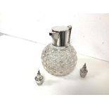 A crystal claret jug with silver mounted spout and handle (h.16cm x 16cm x 13cm) and two small