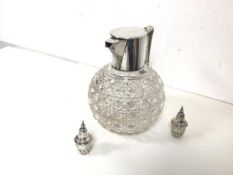 A crystal claret jug with silver mounted spout and handle (h.16cm x 16cm x 13cm) and two small