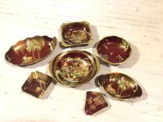 A collection of seven pieces of Caltonware rouge royale including two ashtrays, three oval dishes, a