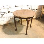 A reproduction mahogany Georgian style occasional table with scalloped moulded edge top, on cabriole