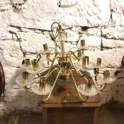 A 1970s twelve arm brass and Czechoslovakian glass chandelier, lacking drops (38cm x 65cm)