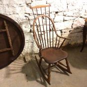 A 19thc cherrywood American Folk art hoop and comb back rocking chair, on turned supports united