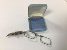 A late 19thc white metal and cut steel lorgnette (16cm)