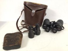 A pair of Swift Newport model no. 825 binoculars (18cm x 19cm x 6cm), complete with leather