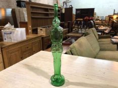 A moulded green glass bottle in the form of a Standing Knight (83cm)