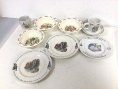A set of three Bunnykins bowls (each: 4cm x 16cm) and two Wedgwood Peter Rabbit mugs, a Peter Rabbit