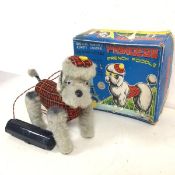 A 1950s battery operated French poodle, Princess, manufactured by Cragstan, complete with original