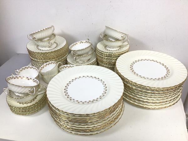 A part Minton dinner service including twenty six dinner plates (d.27cm), eight soup bowls, six