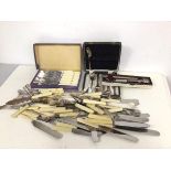 An assortment of Epns including knives, forks, fruit knives, fish knives, etc. and a silver