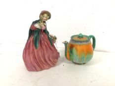 A 1930s Shelley china teapot (11cm x 17cm x 10cm), a Royal Doulton Lady Charmian figure (2)