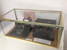 A German Gebrude Schmidt, Nurenburg tin plate toy typewriter, early 20thc. with travelling case