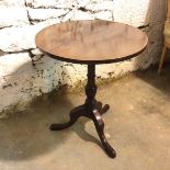 A Georgian style mahogany occasional table with circular top on pedestal base ending in slipper