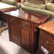 A Chinese cherrywood altar style cabinet, the rectangular top with upswept moulded edge above two