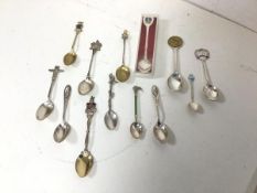 A collection of souvenir and commemorative spoons, some silver, including Australia, Canada,